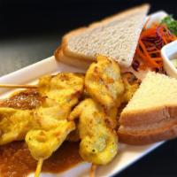 Chicken Satay (4 Pc) · Nuts. Skewers of grilled chicken, toast, peanut sauce, cucumber and onion relish.