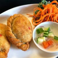 Curry Puff (2 Pc) · Vegetarian. Crisp pastry pocket, curried potato, carrot, green pea, onion.
