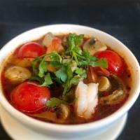 Tom Yum Soup · Hot. Thai style spicy and sour lemongrass soup, mushroom, tomato, cilantro.