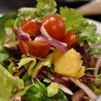 Pineapple Beef Salad · Hot, gluten free. Sliced grilled steak, pineapple, tomato, cilantro, red onion, scallion, le...