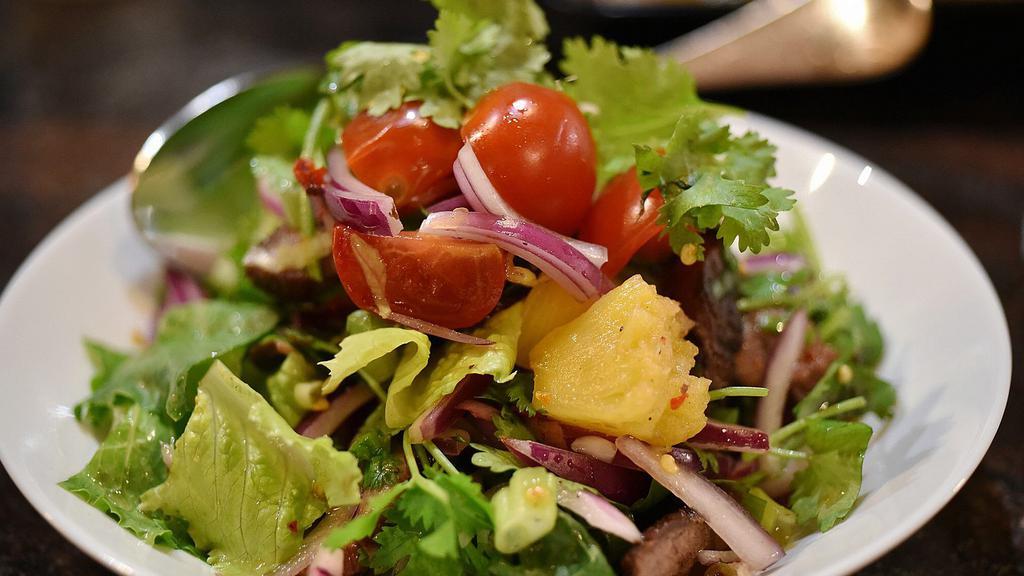 Pineapple Beef Salad · Hot. Sliced grilled steak, pineapple, tomato, cilantro, red onion, scallion, lettuce, spices, fresh lime juice.
