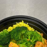 Salmon Bowl  · Yellow rice with seasoned butter broccoli topped with grilled wild caught Salmon