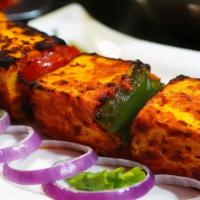 Paneer Shashlik Kebab · Softly done cottage cheese, onion and bell peppers, finished in tandoori oven.