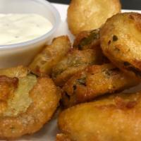 Fried Pickles · Beer Battered Pickle Chips.
Served with a side Ranch Dressing