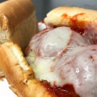 Meatball Parmesan Sub Or Wrap · Meatballs, sauce and provolone cheese.