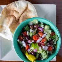 Greek Salad · Romaine lettuce, tomatoes, cucumber, red onions, feta cheese, kalamata olives and pepperonci...