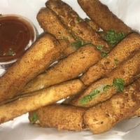 Mozzarella Sticks · Eight pieces breaded and fried, side of gravy.
