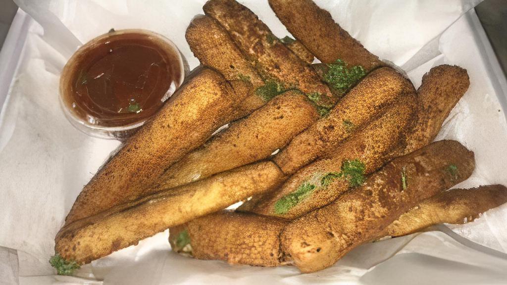 Mozzarella Sticks · Eight pieces breaded and fried, side of gravy.