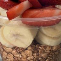 Acai Bowl · Topped with granola, freshly diced banana, strawberries, honey and blueberries.