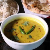 Tadka Dal · Black lentil or yellow split peas slow cooked in an aromatic herbs and spices.