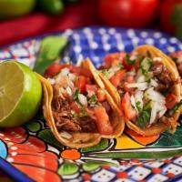 3 Authentic Tacos · Choice of meat, onions, cilantro and salsa.