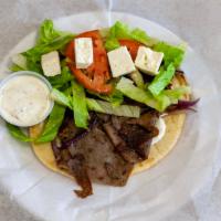 Lamb Gyro · Served with lettuce, tomatoes, onions & gyro sauce on pita bread.