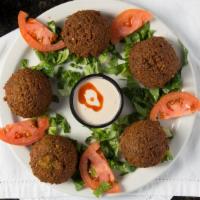 Falafel · Delighteddy spiced vegetarian patties made from a mixture of garbanzo and fava beans, parsle...