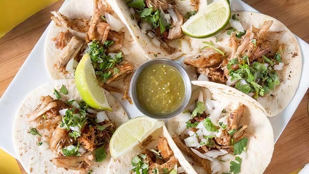 Street Tacos · Six tacos with carnitas pork, chicken, or steak, diced onions and cilantro. Served with tomatillo salsa and lime wedges.