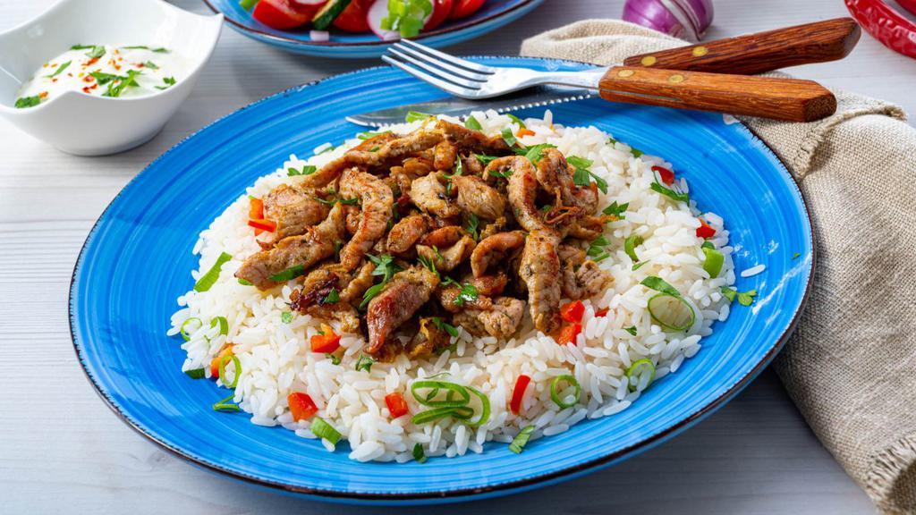 Chicken Gyro With Rice · Delicious juicy chicken gyro over rice, served with lettuce, tomatoes, green peppers, onions, olives and mixed pickles.