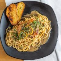 Chicken Picatta · Chicken breast, linguine, capers, lemon, garlic, and butter.