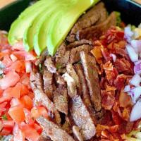 Tri Tip Cobb Salad · Grilled Tri Tip, Romaine Hearts, Bleu Cheese Crumbles, Diced Bacon, Avocado, Tomato, Red Oni...