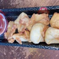 Crab Rangoon (6 Pieces ) · Crab and cream cheese filled wontons fried until golden brown.