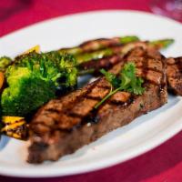New York Strip (12 Oz) · America’s most popular steak, lean and tender. Served with your choice of 2 sides.