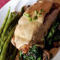 Salmon Yvette · Mushrooms and spinach in a sherry & cream sauce. Served with a choice of soup or salad.