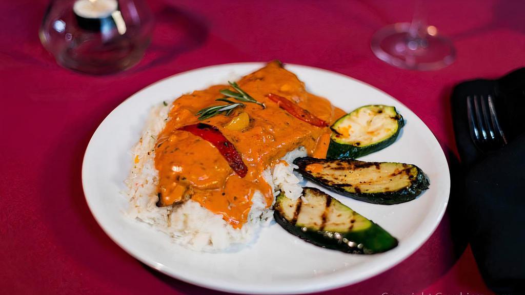 Bangkok Red Curry Fish · Thai curry trout served with rice, zucchini, and a choice of cup of soup or house salad.