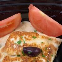 Halloumi Cheese · Grilled halloumi cheese served with tomatoes olive oil , mint and pita bread Vegetarian