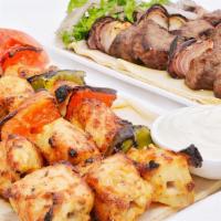 Ground Chicken Kabob · Ground Chicken skewered and seasoned with Middle Eastern Spices Grilled 

Choose two sides 
...
