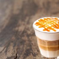 Macchiato Caramello Double · Freshly steamed milk with vanilla/caramel-flavored syrup toppedwith 2 espressos and finished...