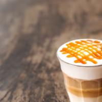 Macchiato Caramello Triple · Freshly steamed milk with vanilla/caramel-flavored syrup topped  with 3 espressos and finish...