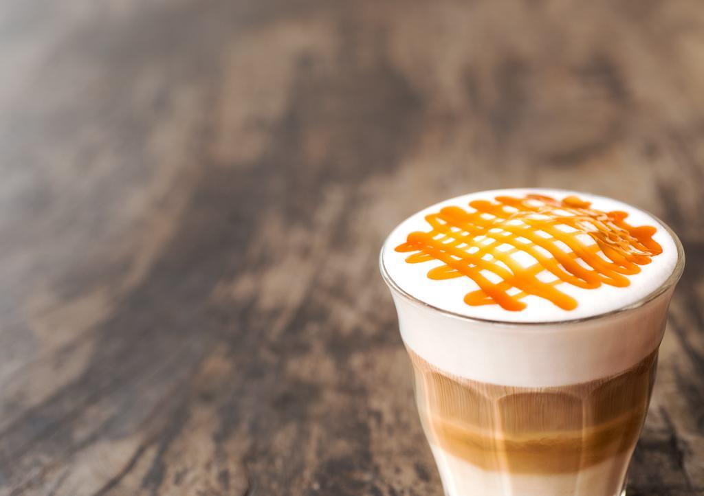 Macchiato Caramello Triple · Freshly steamed milk with vanilla/caramel-flavored syrup topped  with 3 espressos and finished with a caramel drizzle  20 ounces