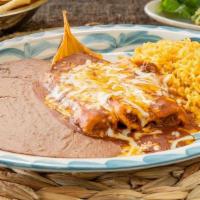 Housemade Tamale Dinner · House-made Pork Tamales topped with chili gravy and melted cheese and served with your choic...
