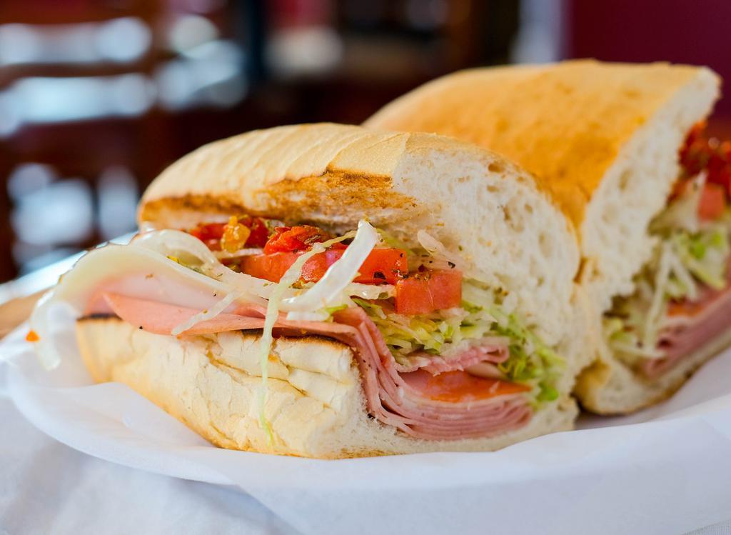 Italian · Mortadella, capicola, Genoa salami, provolone cheese, lettuce, tomatoes, onions, hot peppers, and Italian dressing. Served on a toasted sub roll.
