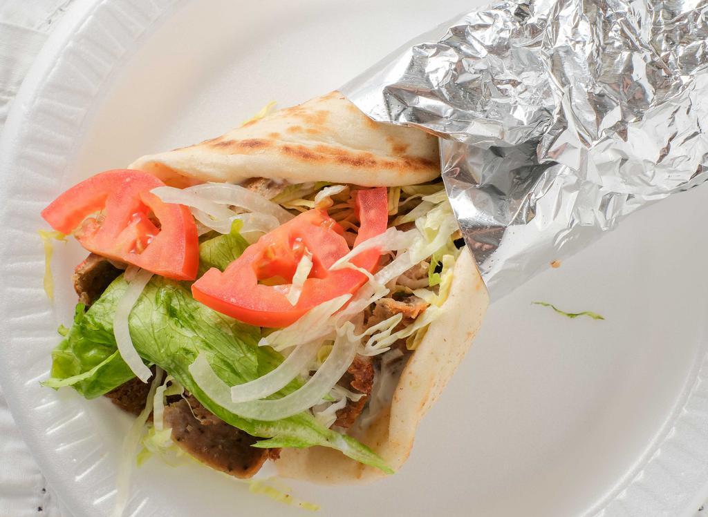 Lamb Or Chicken Gyro · Gyro, lettuce, tomatoes, and onions covered with your choice of cucumber sauce or honey mustard dressing. Served on pita bread.