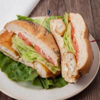 Filet Of Fish Sandwich · Filet of fish sandwich served on a Kaiser roll with lettuce and tomato and a side of tartar ...