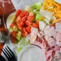 Chef'S Salad · Oven roasted turkey breast and imported danish ham served on a bed of salad greens with chee...