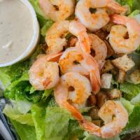 Shrimp Caesar Salad · Grilled shrimp served on a bed of Romaine lettuce with cucumbers, croutons, and Parmesan che...