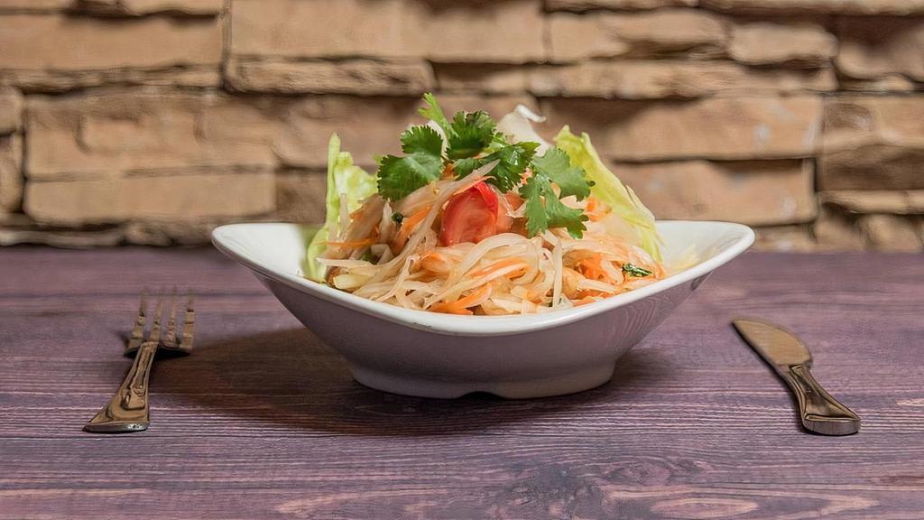 Som Tom Thai · FRESH GREEN PAPAYA SALAD, SHREDDED CARROTS AND CHERRY TOMATOES PREPARED IN A MIXTURE OF LIME JUICE, FRESH THAI CHILI, PALM SUGAR, FISH SAUCE, AND CRUSHED PEANUT. CAN BE V|VEG|GF
