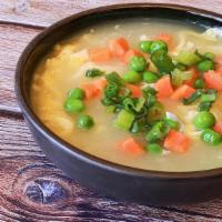 Sm Egg Drop Soup · CHINESE EGG SOUP WITH PEAS, CARROTS, SPRING ONIONS AND A SIDE OF CRISPY FRIED WONTON STRIPS....