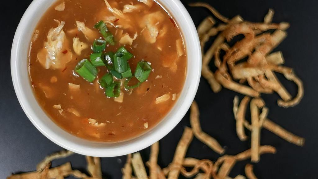 Sm Hot & Sour Soup · CHINESE HOT AND SOUR SOUP WITH EGG,BAMBOO SHOOTS, TOFU, SPRING ONIONS AND A SIDE OF CRISPY FRIED WONTON STRIPS. VEG