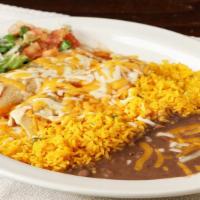 Pork Enchilada · Topped with ranchera sauce. Two rolled corn tortillas with pork, covered with melted cheese....