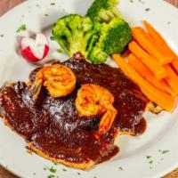 Pollo Al Mole · Grilled chicken breast, topped with shrimp and poblano mole sauce. Served with white rice, s...