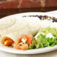 Tacos De Pescado · Three soft fresh flour tortillas, filled with broiled tilapia, sauteed onions, green peppers...