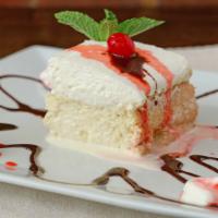 Tres Leches · Traditional cake floating in sweet creamy milks.