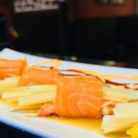 Salmon Wraps (4) · Fresh salmon sashimi wrapped with spicy crab salad,mango, cucumber in chef special sauce