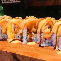 Beauty Roll   · spicy crabmeat and cream cheese inside,w. mango and salmon ,chopped peanuts on top