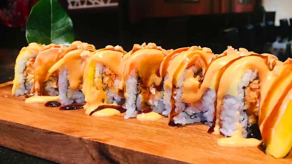 Beauty Roll   · spicy crabmeat and cream cheese inside,w. mango and salmon ,chopped peanuts on top