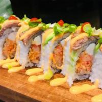Rich Roll · spicy crabmeat and cream cheese inside,beef and avocado scallions on top