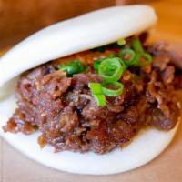 Bulgogi Bao · Marinated beef rib-eye, kimchi, green onions.