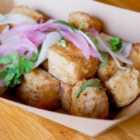 Popcorn Tofu · Marinated tofu, deep fried and sprinkled with house seasoning, topped with onions, pickled o...
