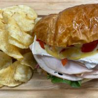 Turkey & Brie · Turkey breast, brie cheese, roasted red peppers, and honey dijon dressing on freshly baked c...